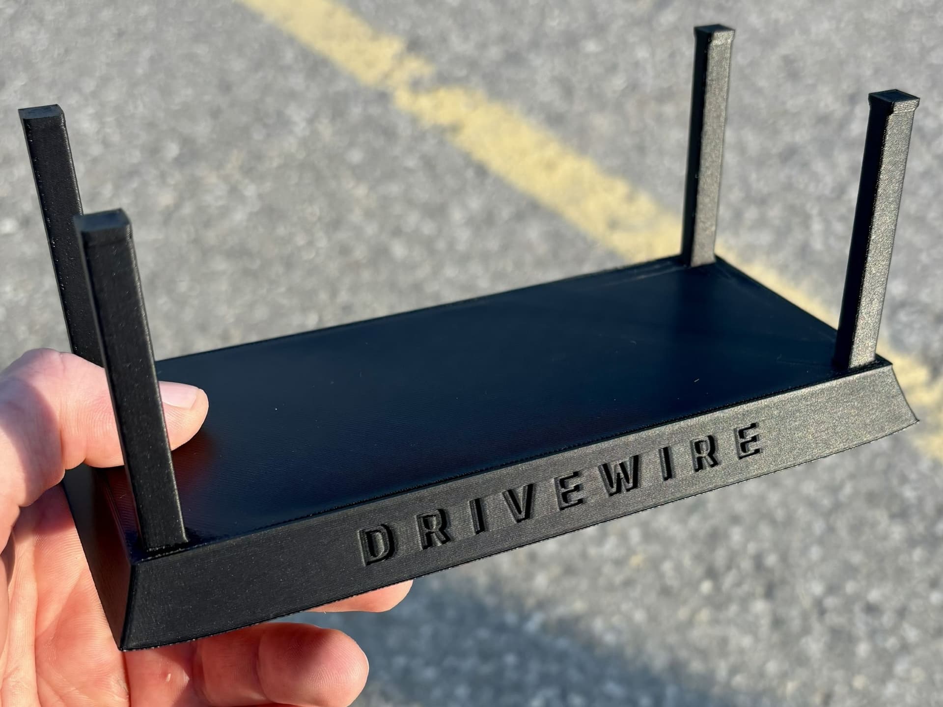 Finished black PLA DriveWire support stand with engraved front lettering