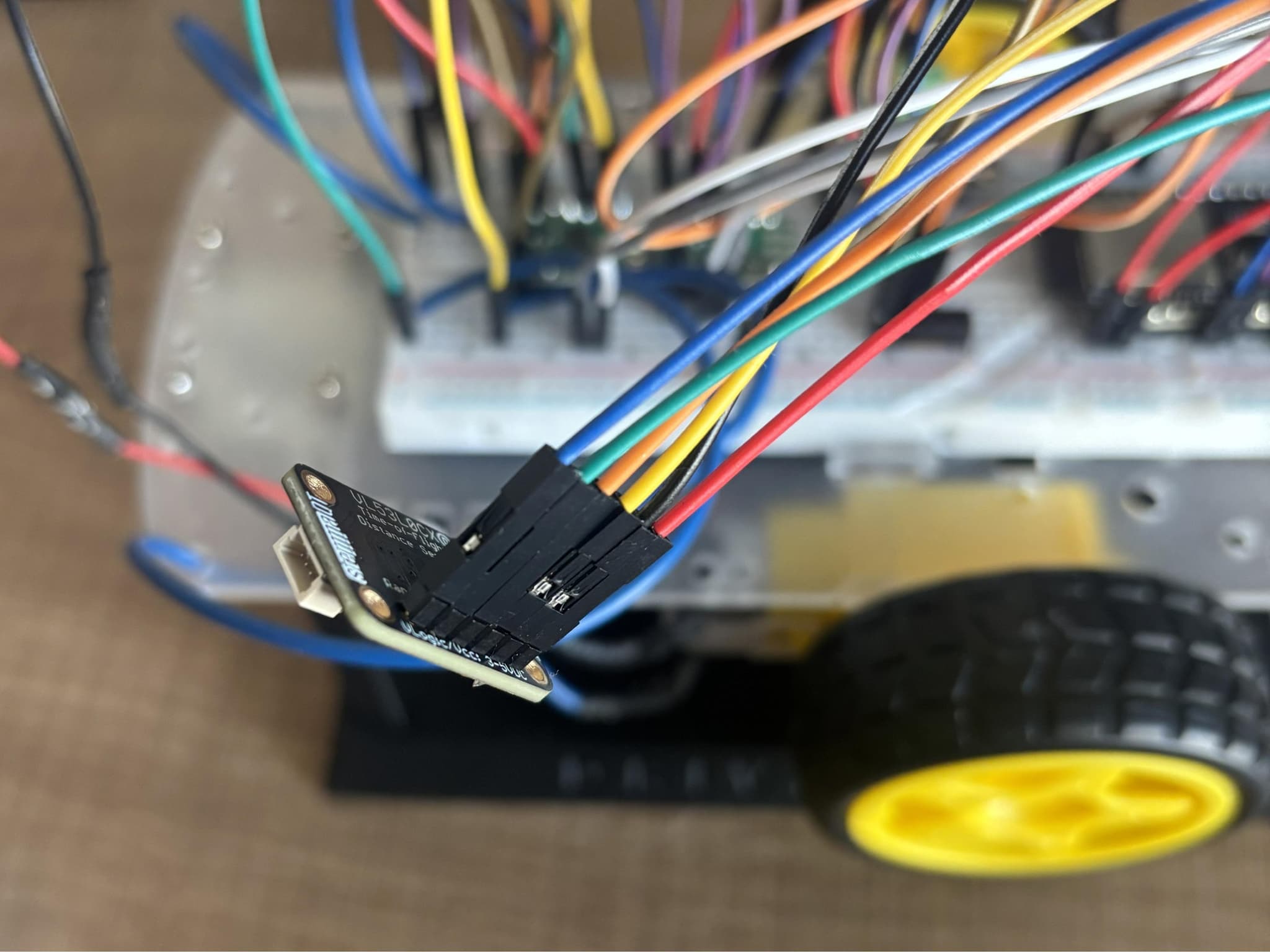 VL53L1X time-of-flight sensor wired and mounted at the front of the DriveWire chassis
